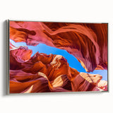 Antelope Canyon landscape art on silver-framed canvas, highlighting orange and black tones, ideal for office decor.