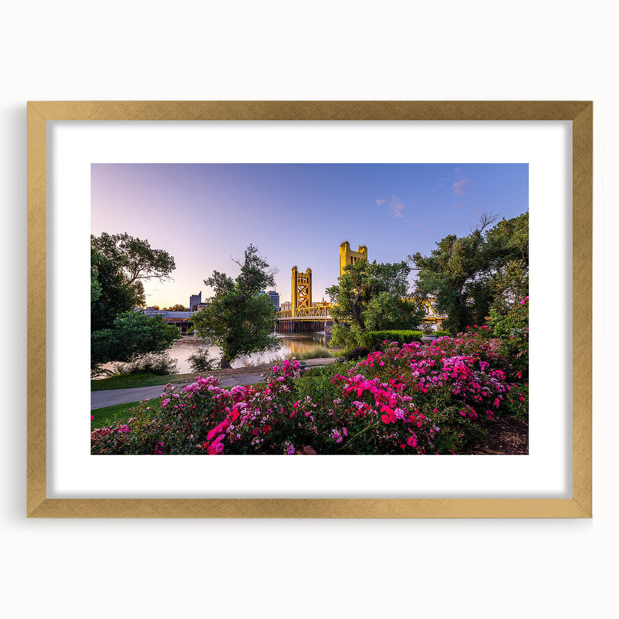 Extra large abstract art print of Sacramento scenery in muted earth tones on a gold-framed canvas.