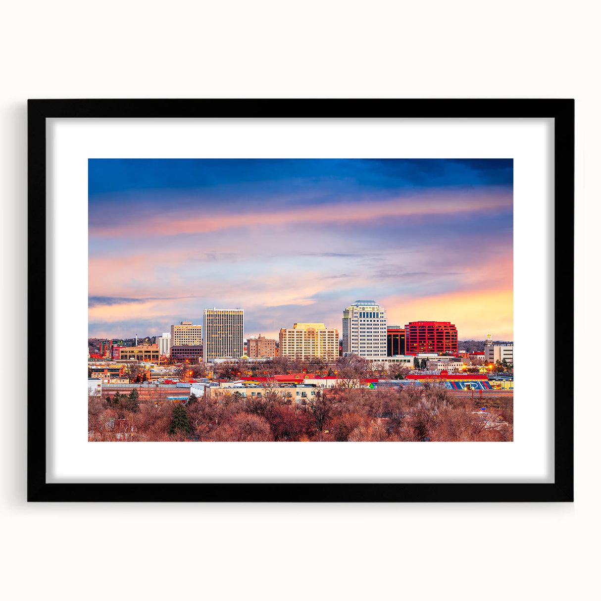 Extra large abstract art print of Colorado Springs in vibrant colors on a textured canvas, framed in black.