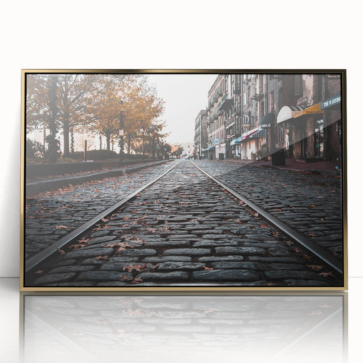 Mid-century modernist style large art print of Savannah, Georgia, in a gold acrylic frame, muted earth tones.