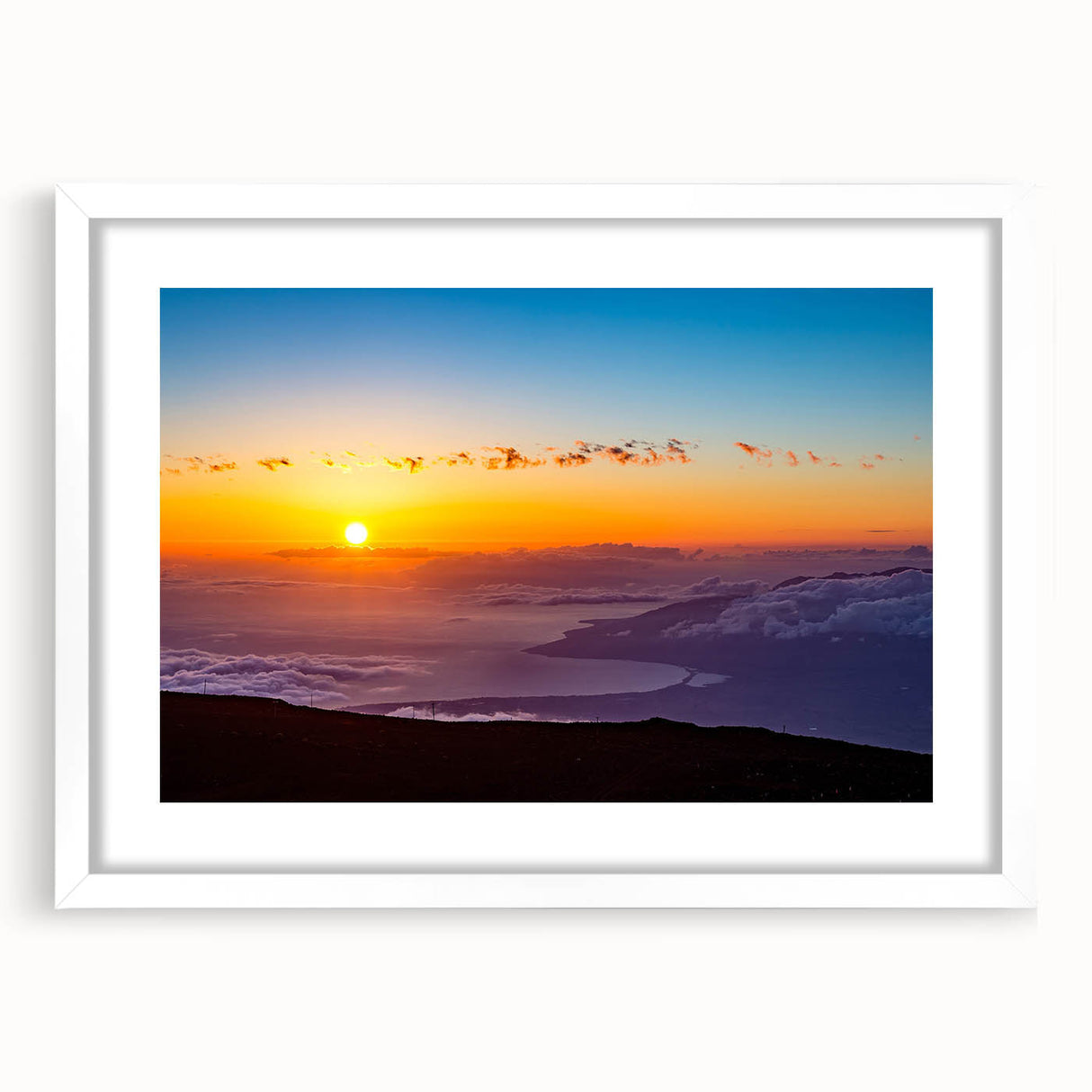 Abstract art print of a Maui landscape in muted green and blue tones on a framed white mat.