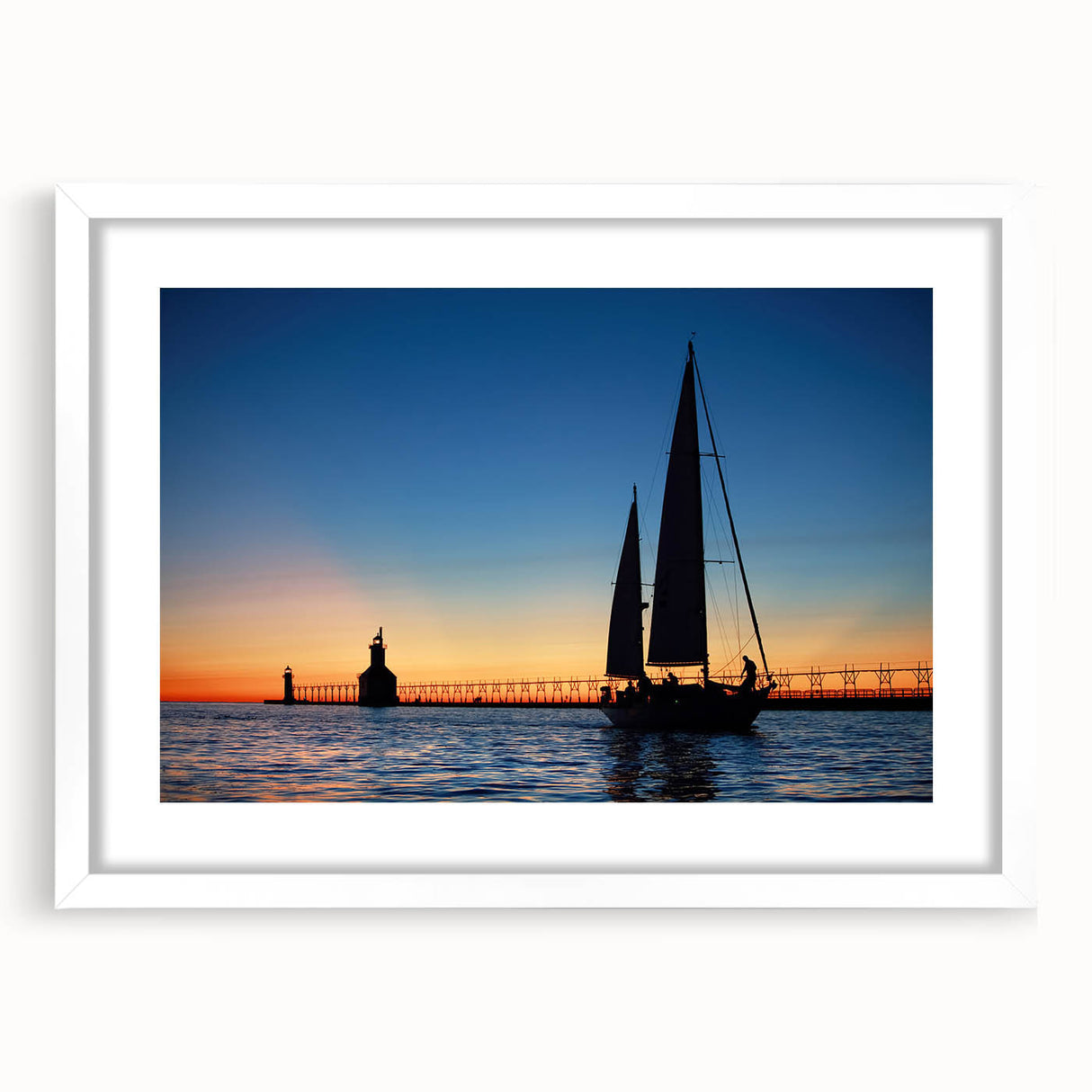 Abstract art print of Lake Michigan in muted blue and green tones, framed with a white mat, ideal for dining room decor.
