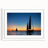 Abstract art print of Lake Michigan in muted blue and green tones, framed with a white mat, ideal for dining room decor.