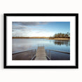 Colorful abstract art print of Iowa scenery in vibrant hues, framed with a black mat.