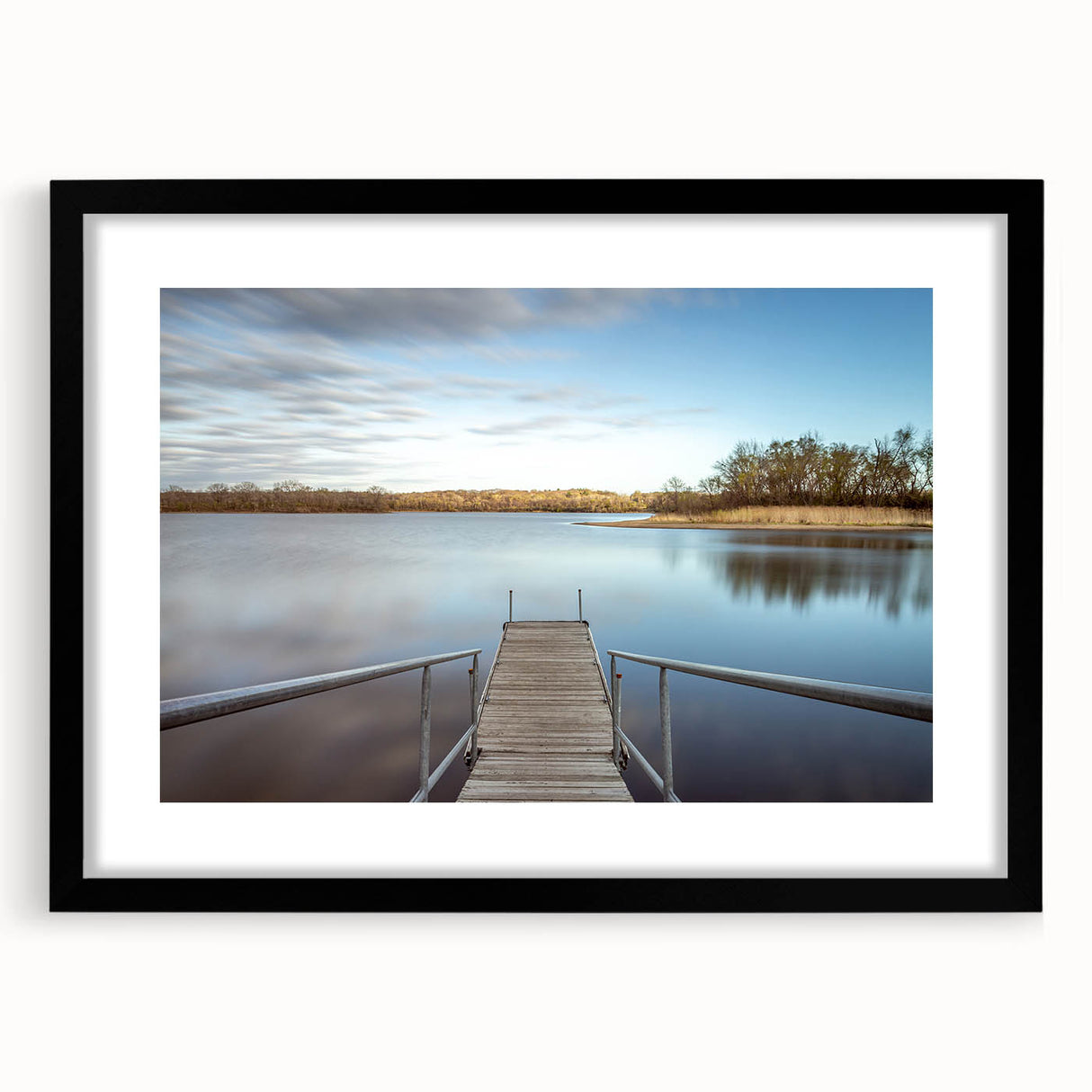 Colorful abstract art print of Iowa scenery in vibrant hues, framed with a black mat.