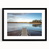 Colorful abstract art print of Iowa scenery in vibrant hues, framed with a black mat.