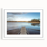 Abstract art print of Iowa scenery in muted green and blue, framed with a white mat, suitable for dining room decor.