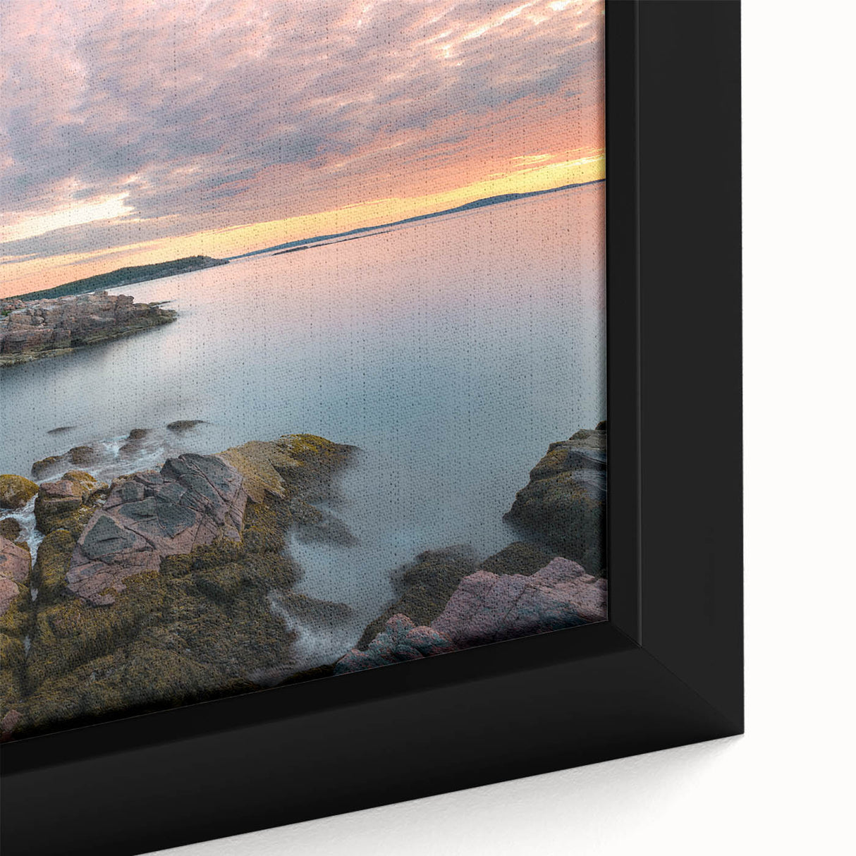 Close-up of a textured black wall art depicting Acadia, Maine, with colorful accents on a framed canvas.
