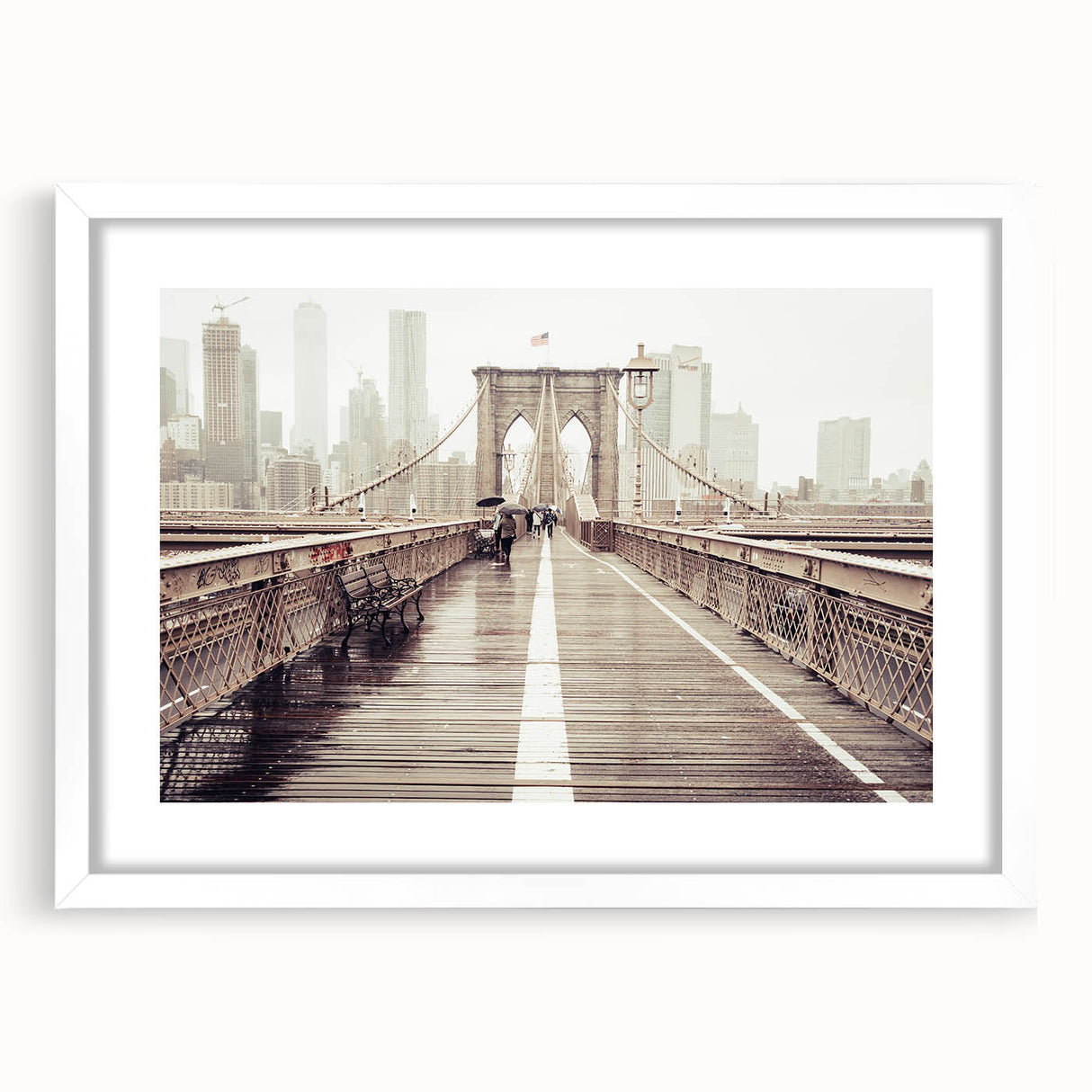 Abstract art print of the Brooklyn Bridge in muted gray and blue tones on a framed white matte canvas.