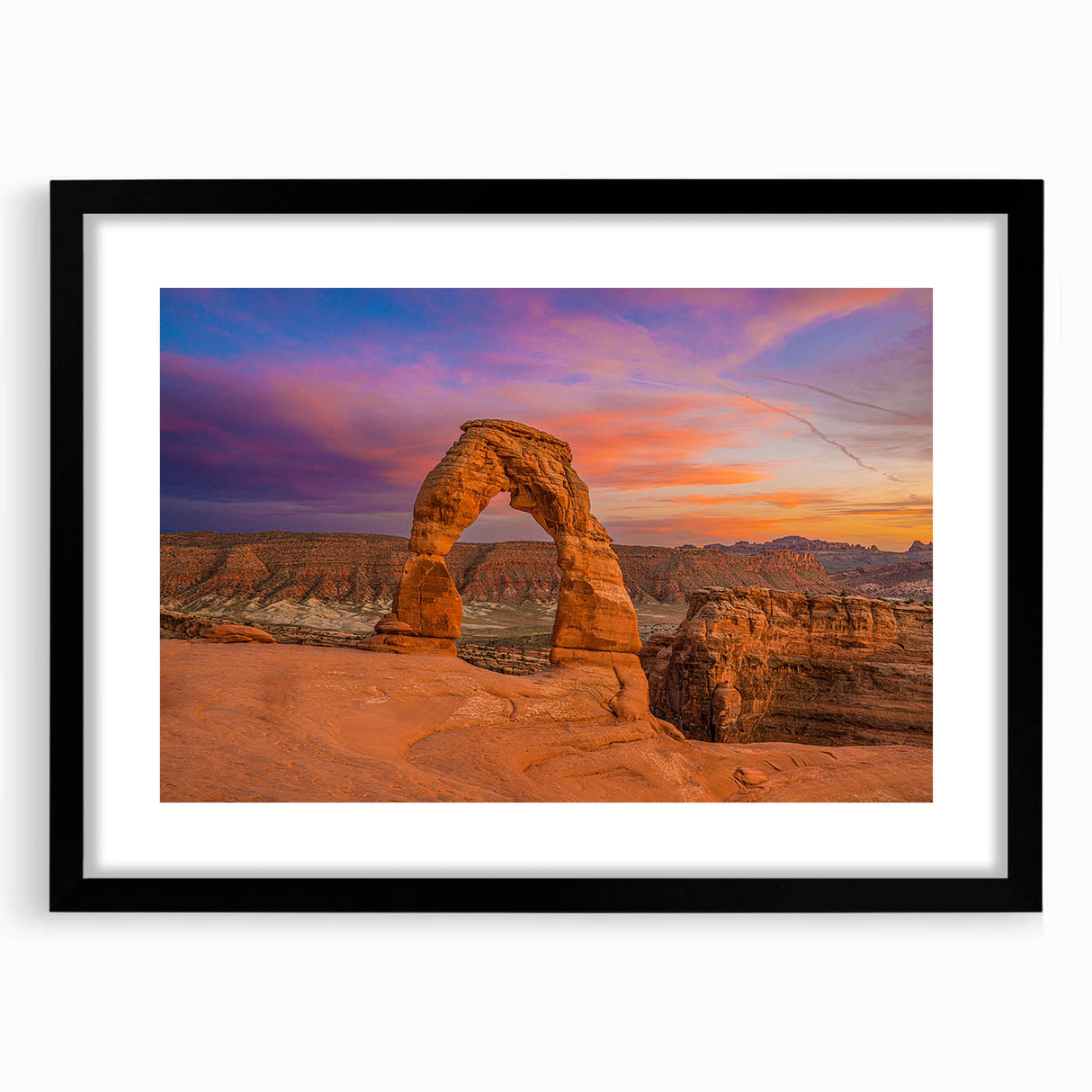 Extra large abstract art print of colorful Utah Arches scenery on textured canvas, framed in black.