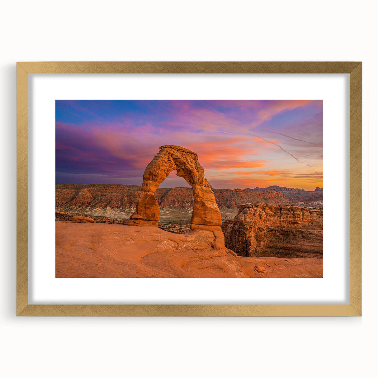 Extra large wall art featuring a textured abstract print of Utah's Arches in muted earth tones, framed in gold.