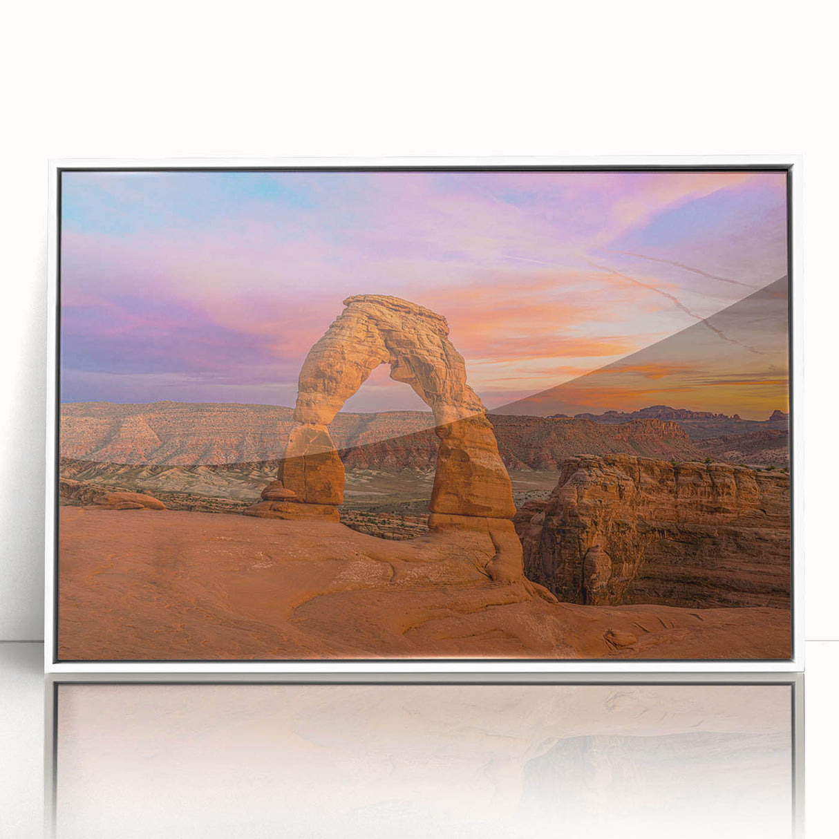 Acrylic print of Arches National Park in muted earth tones, framed in white, suitable for modern art wall decor.