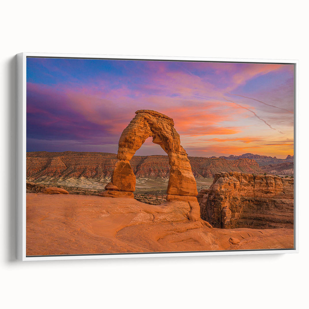 Vintage poster art of Arches National Park on framed canvas, featuring vibrant red and orange tones.