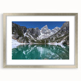 Textured art print of Wyoming's Grand Tetons in muted earth tones on a silver-framed mat, suitable for bedroom decor.