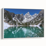 Vintage poster art of Grand Tetons on a framed canvas, featuring a black and colorful palette, ideal for living room decor.