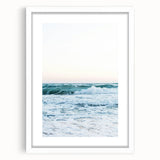 Abstract art print featuring swirling blue and green hues on a white framed canvas.