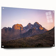 Side view of a vibrant acrylic glass artwork depicting colorful cliffs and landscapes, secured with pins for display, highlighting natural beauty and artistic craftsmanship.