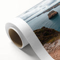 Stunning rolled canvas print of a dramatic landscape featuring rugged cliffs and a vibrant sky, ideal for enhancing home decor with nature's beauty.