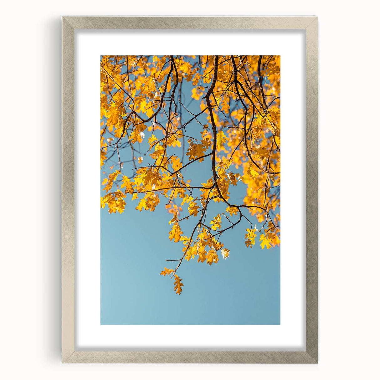 Textured abstract art print in warm orange and red hues on a silver framed canvas, suitable for bedroom decor.