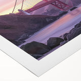 Rolled canvas print showcasing a vibrant landscape bridge design with lush greenery and a serene river, elegantly packaged in a protective cardboard tube for safe delivery.