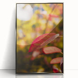 Mid-century modernist art featuring a fall scene in muted orange and brown tones on a silver-framed acrylic print.