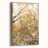 Framed canvas featuring a vintage-style landscape painting with autumnal trees in gold and black tones.
