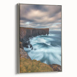 Framed canvas artwork depicting a stunning cliff landscape with vibrant colors and intricate details, set in a silver frame for an elegant display.