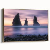 Framed canvas artwork showcasing a dramatic landscape of cliffs under a vibrant sunset, accented with a gold frame, perfect for home decor.