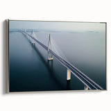 Framed canvas artwork depicting a serene landscape bridge scene with silver frame, ideal for home decor. Captures natural beauty and tranquility in vibrant colors.