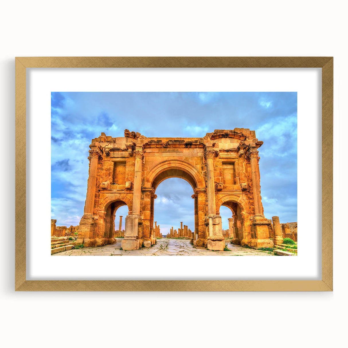 Textured abstract art print depicting an Algerian desert scene in warm earth tones, framed in gold.