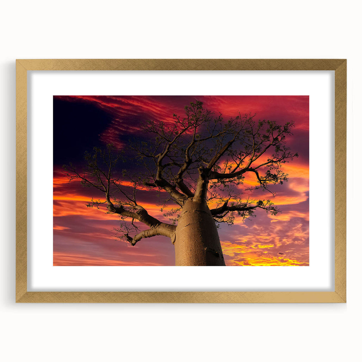 Textured abstract art print of Madagascar scenery in a gold frame, ideal for bedroom wall decor.
