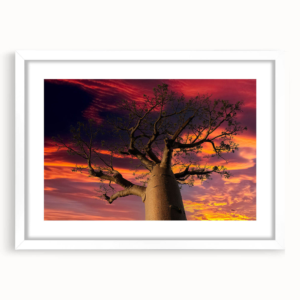 Extra large abstract art print of Madagascar scenery in textured style, with muted earth tones on a white framed canvas.