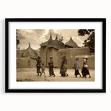 Extra large abstract art print of a Mali scenery in vibrant colors on a textured canvas, framed in black.