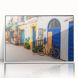 Large art print of a Moroccan landscape in mid-century modernist style, framed in white acrylic.