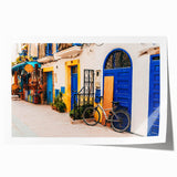 Extra large rolled print of a Moroccan landscape with vibrant floral elements on canvas, suitable for dining room decor.