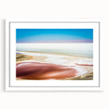 Abstract art print of a Tunisian landscape in muted earth tones on a framed white mat, ideal for dining room decor.