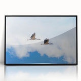 Large abstract wall art depicting a Bhutanese scenery in muted earth tones, framed in black acrylic.