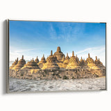 Framed canvas of a vintage-style Indonesian landscape painting, featuring vibrant colors on a black background.