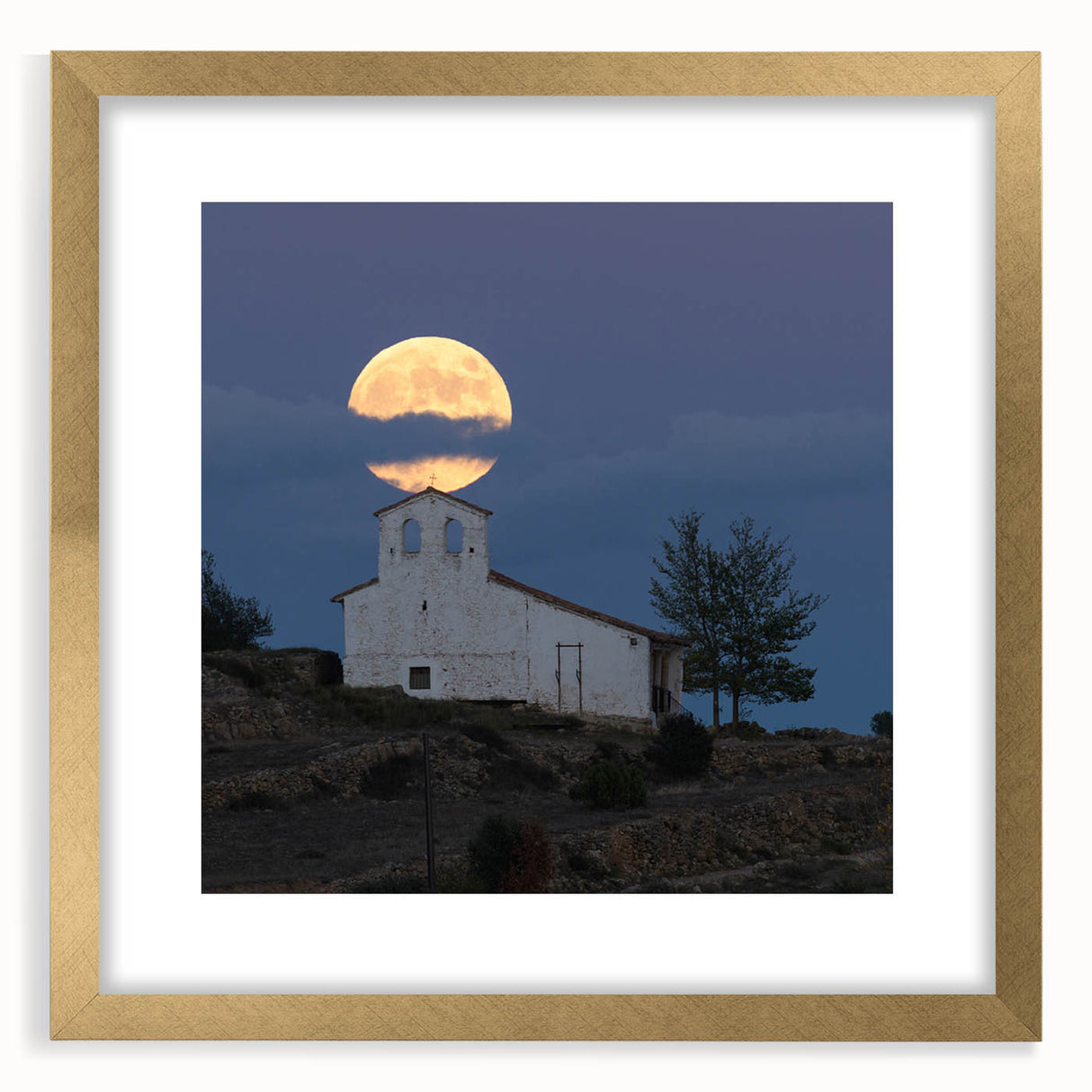 Abstract art print depicting a Caribbean scenery in muted blue and green shades, framed in gold.