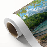 Art deco poster of a serene Caribbean beach scene on rolled canvas, with pastel blue and pink tones.