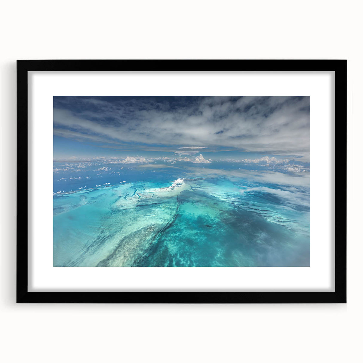 Abstract art print of Caribbean scenery in vibrant colors on a textured, extra large canvas, framed in black.