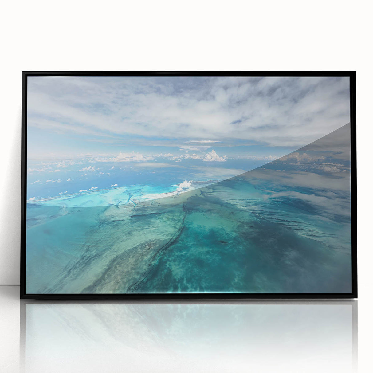 Large abstract wall art depicting a Caribbean seascape in vibrant blue tones on a framed acrylic.
