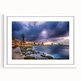 Textured art print depicting an abstract Caribbean scenery in vibrant blue and green tones, framed with a white mat.