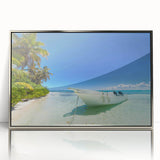 Art deco style poster of a Caribbean scenery in silver framed acrylic, featuring soft blue and green tones.