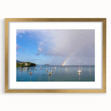 Abstract art print of a Caribbean scenery in muted blue and green tones on a framed canvas, ideal for dining room decor.