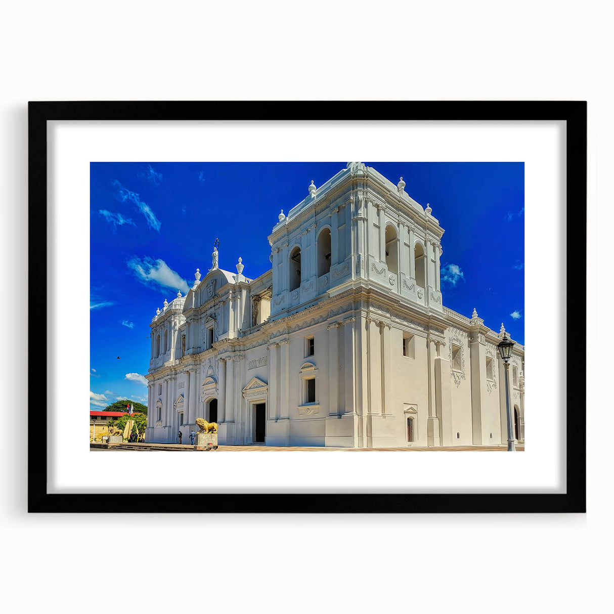 Abstract art print of a vibrant, colorful Central American scenery on a large textured canvas, framed in black.