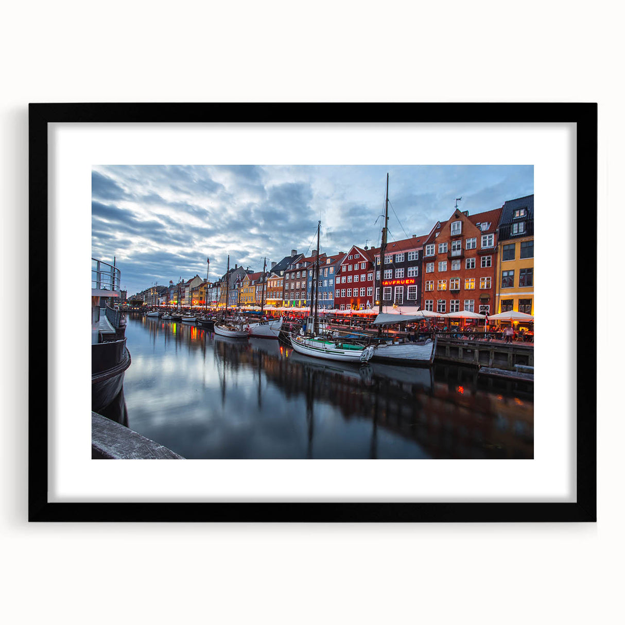Extra large abstract art print of a colorful, textured European scenery on a black framed canvas.
