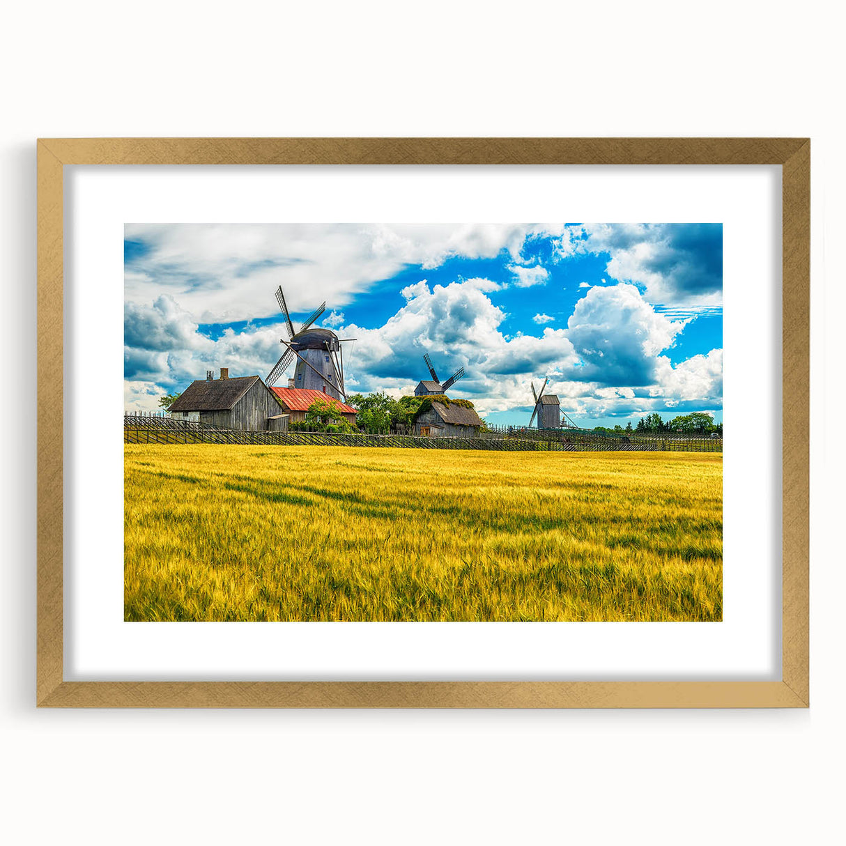 Abstract art print of a European scenery in muted gold and green tones, framed with a gold mat.