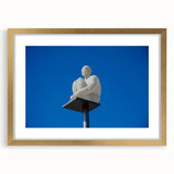 Abstract art print of Nice, France in muted blue and gold tones on a framed canvas, ideal for dining room decor.