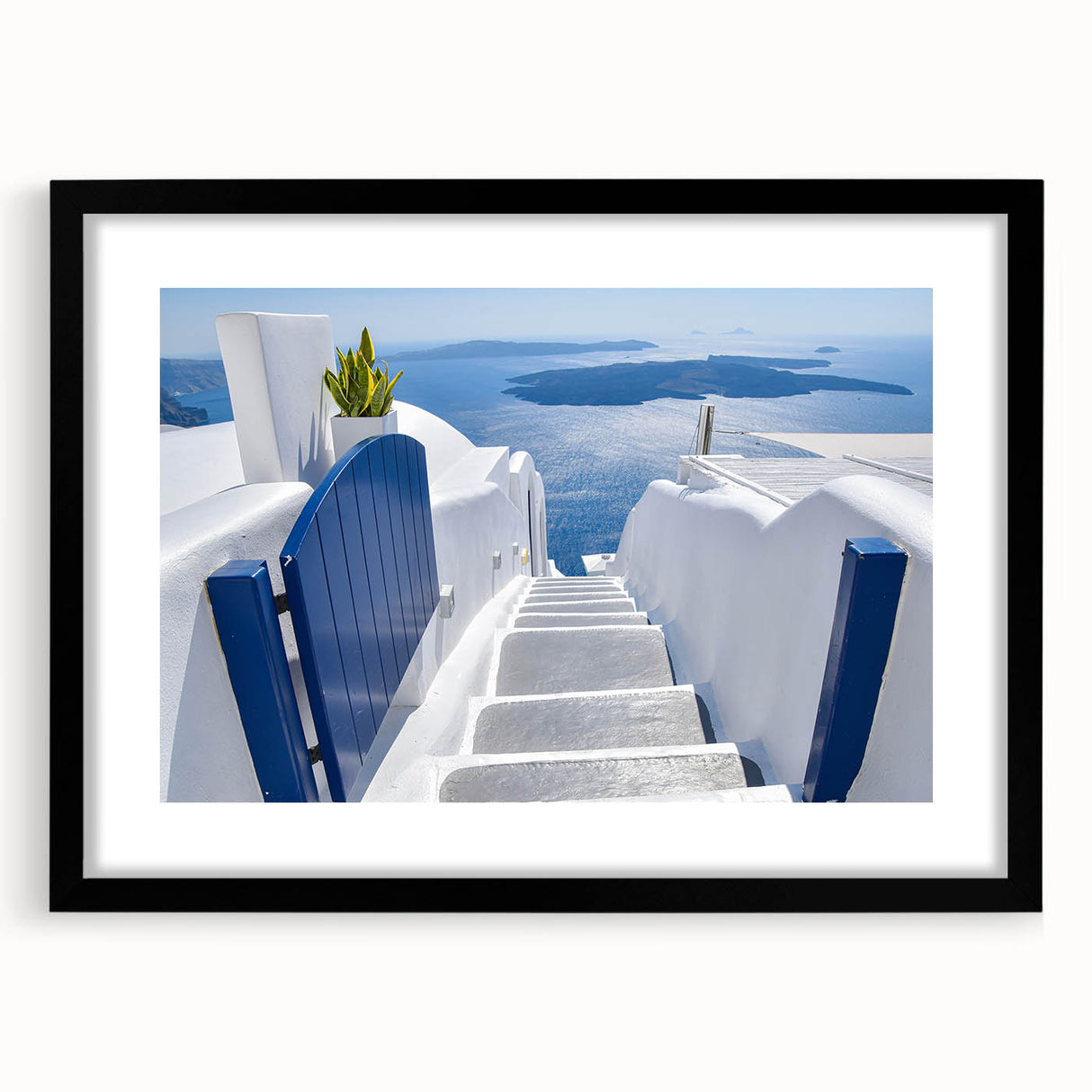 Extra large framed wall art of Santorini with vibrant blue and white hues, ideal for living room decor.